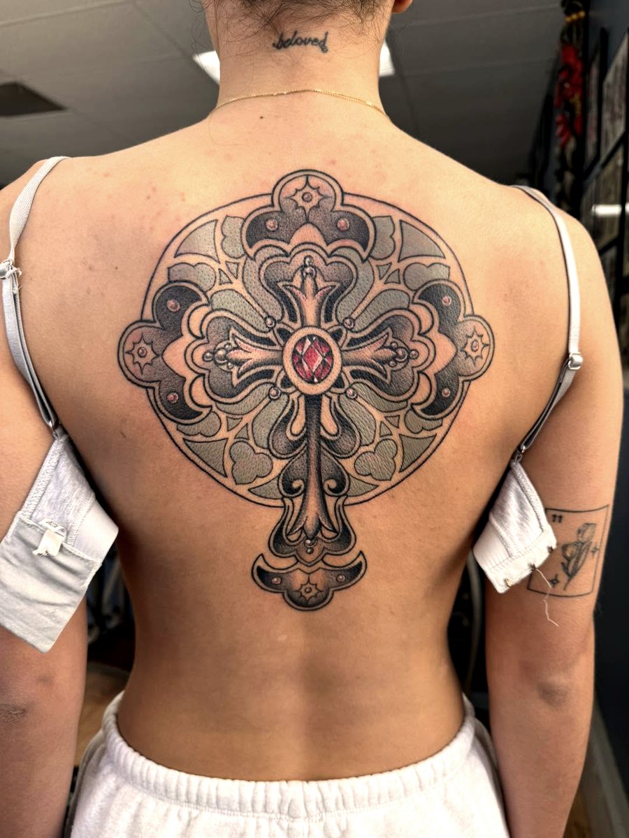 Ornamental mandala and cross back piece tattooed at Blind Faith Tattoo