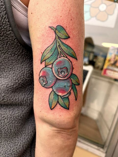 Colour blueberry branch arm tattoo