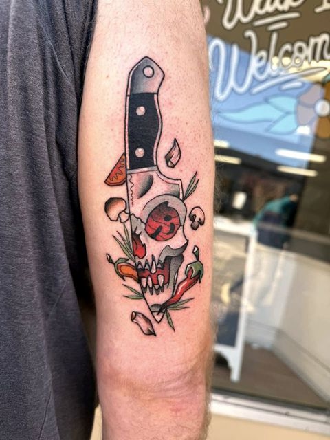 Colour traditional cleaver and rose arm tattoo