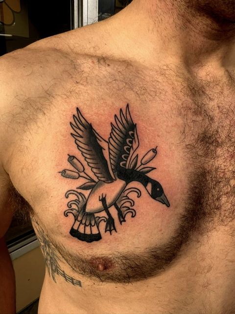 Black and grey eagle and dagger chest piece