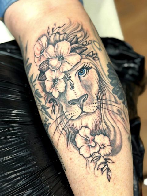 Black and grey lion and florals forearm