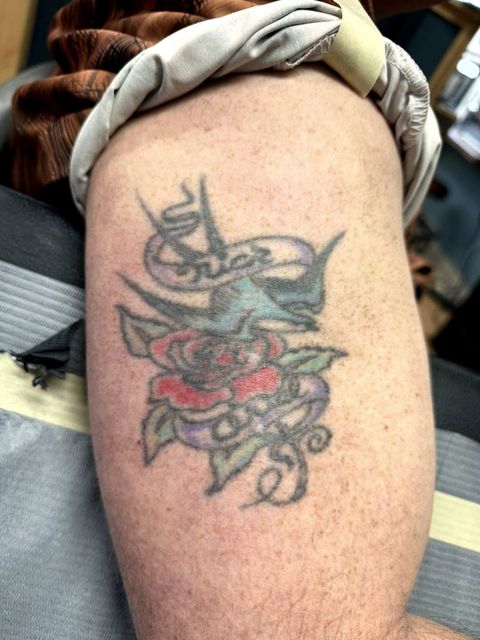 Colour traditional skull and rose shoulder