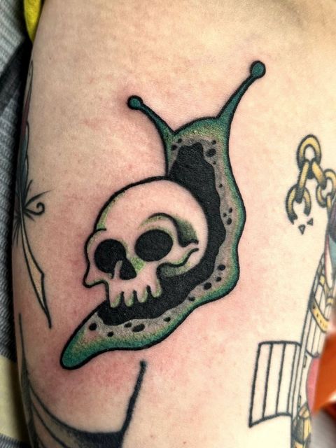 Colour skull snail tattoo