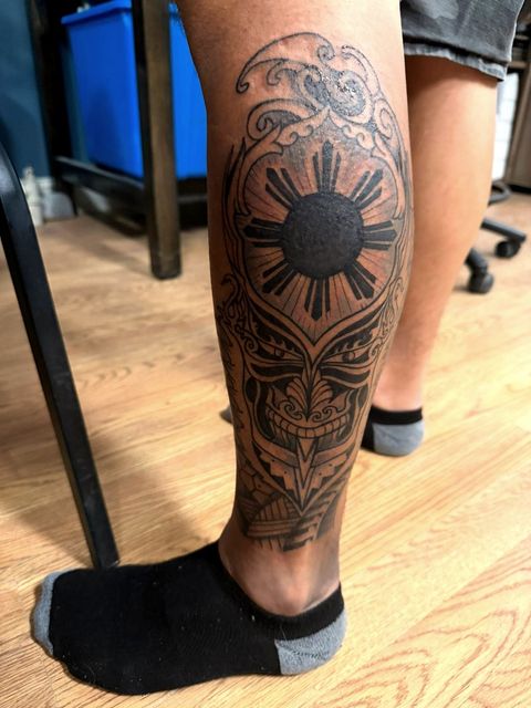 Blackwork sun and ornamental calf piece