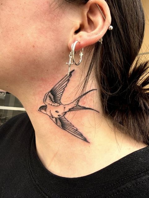 Swallow neck tattoo